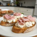 A delicious plate of Whipped Ricotta Crostini with Mortadella